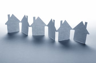 close up of houses cut out of paper on white background-2